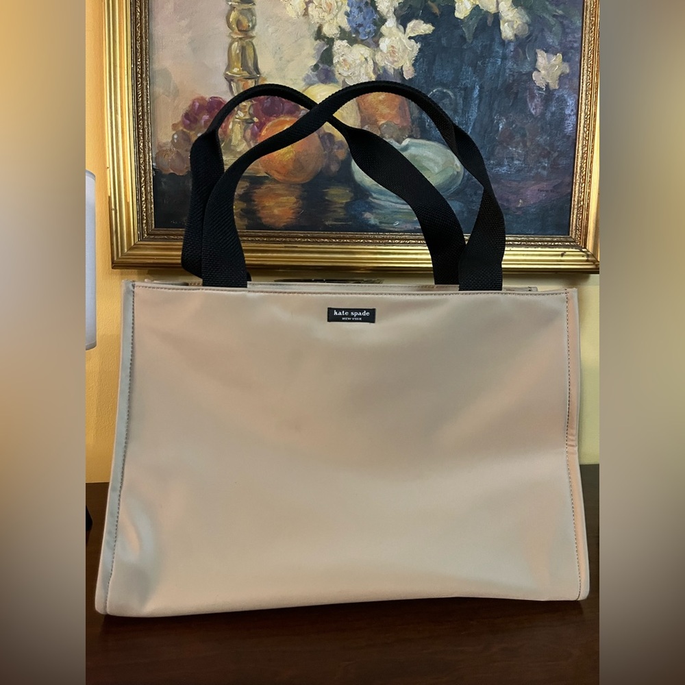 Kate Spade Tan Nylon Tote with Black Handles. Black Interior with zipper pocket.
